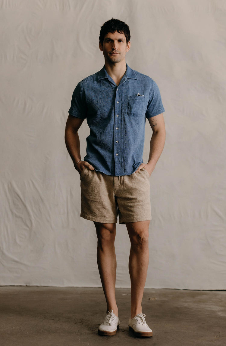 The Hawthorne Camp Shirt in Washed Indigo Crepe editorial shot—collection with text overlaying